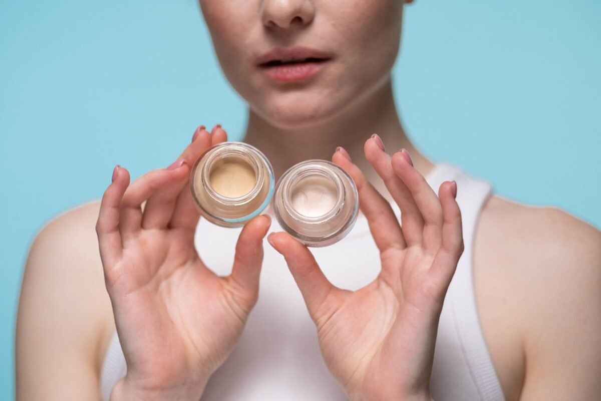 Two jars of cream concealer in different shades, shown to help choose the right concealer